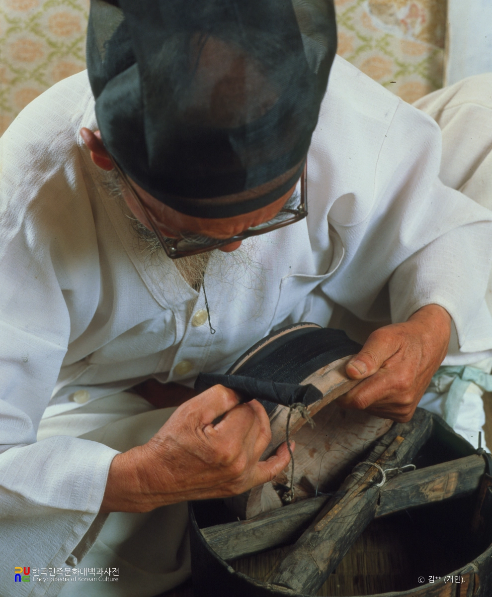 망건장 / 삶기위해 골에다 동여매기